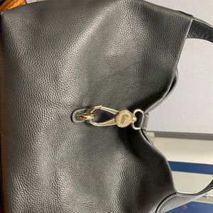 Dooney and Bourke Beautiful Gray Handbag in good condition. In a smoke free home